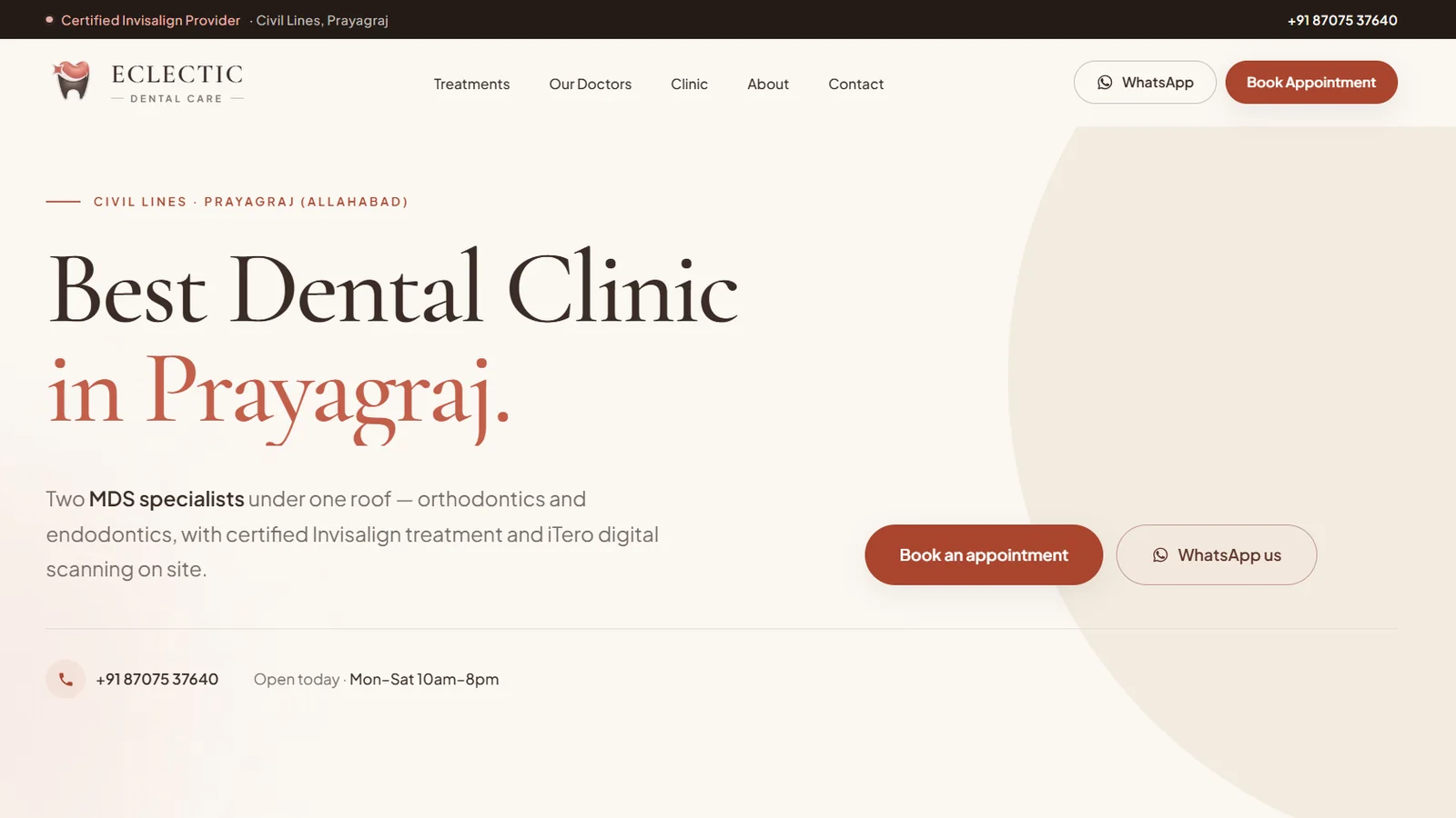 Eclectic Dental Care website hero on a warm cream background with the serif headline ‘Best Dental Clinic in Prayagraj.’ and terracotta ‘Book an appointment’ and WhatsApp buttons.